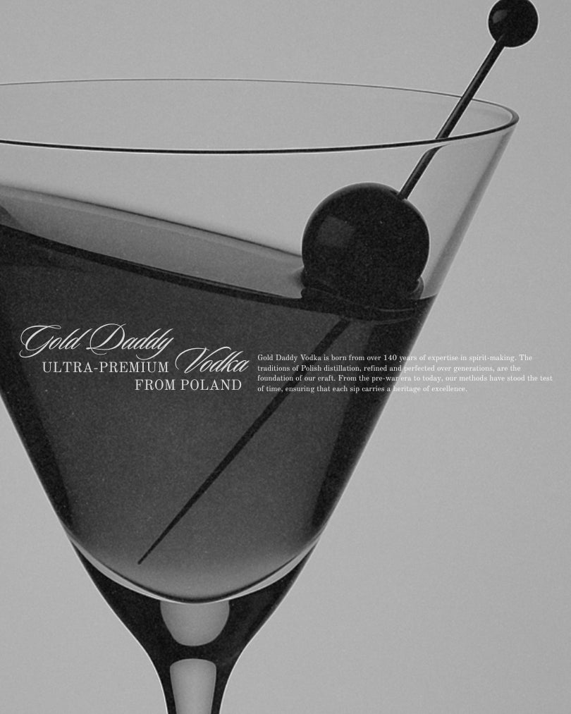 Close-up of a martini glass with olives in black and white